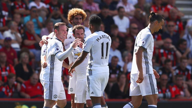 Wayne Rooney celebrates after scoring United's second goal at the Vitality Stadium