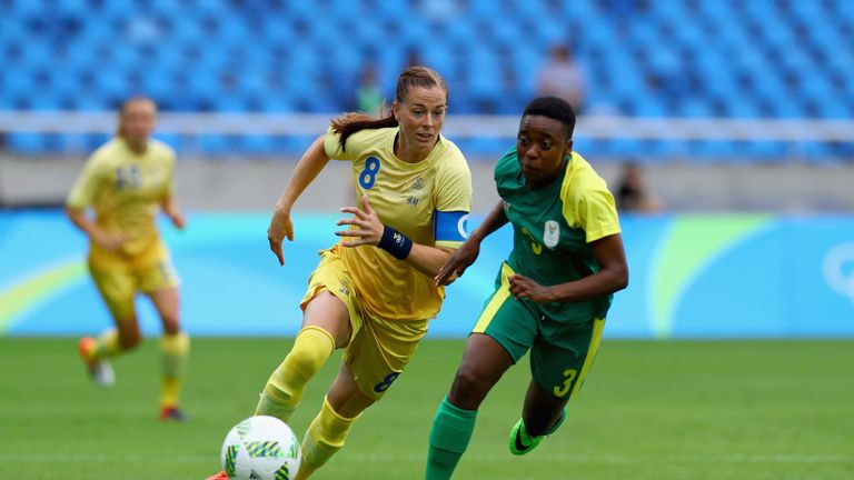 Lotta Schelin of Sweden battles for the ball with Nothando Vilakazi of South Africa