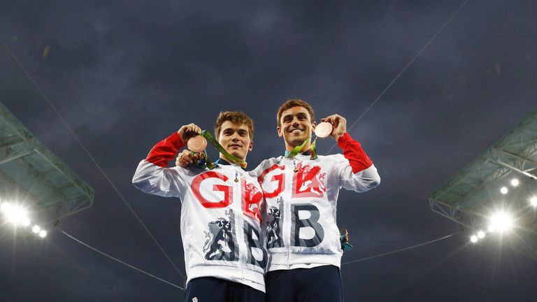 Daniel Goodfellow (left) and Tom Daley celebrate on the podium
