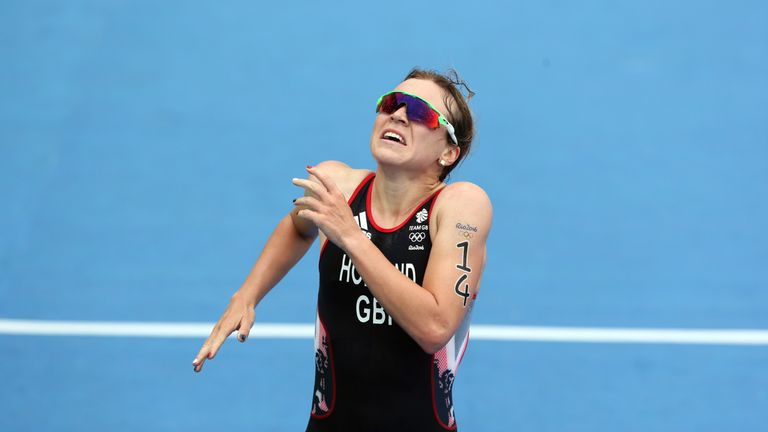 Holland crosses the triathlon finishing line in third place for Team GB