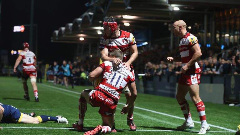 Purdy is congratulated by team-mates after scoring a late try 