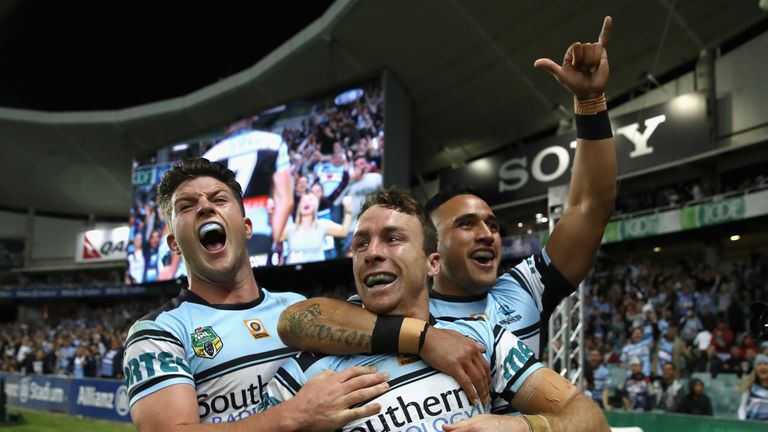 James Maloney of the Sharks celebrates with his team-mates after scoring a try against North Queensland