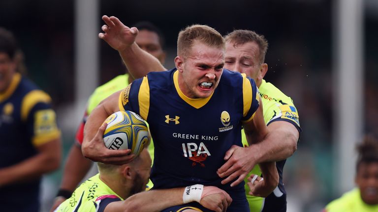 Perry Humphreys is tackled by Byron McGuigan 