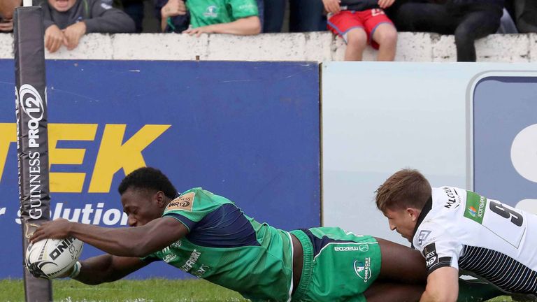 Connacht wing Niyi Adeolokun stretches to score a try against Glasgow