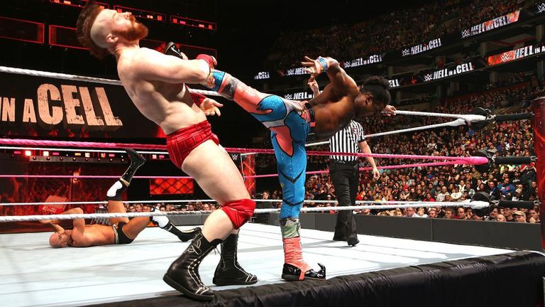Sheamus is kicked by Xavier Woods during tag-team action