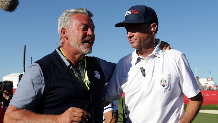 Darren Clarke congratulates Davis Love III after USA regained the Ryder Cup