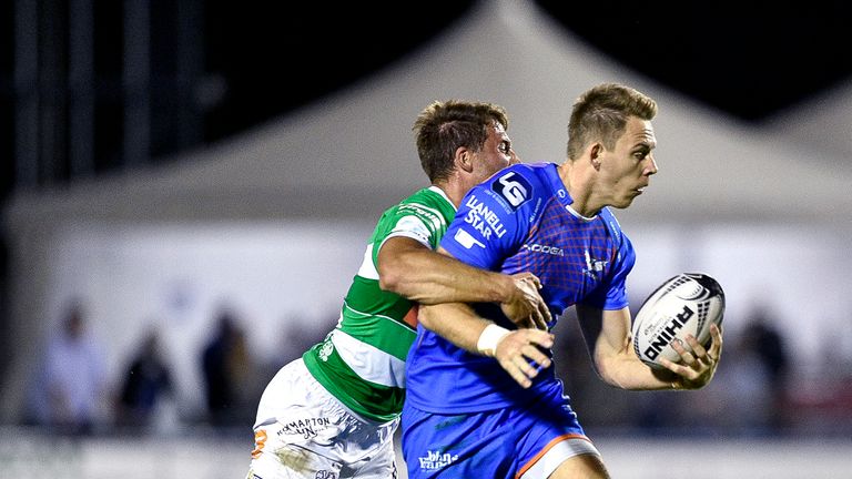 Liam Williams is tackled by Tommaso Benvenuti of Treviso