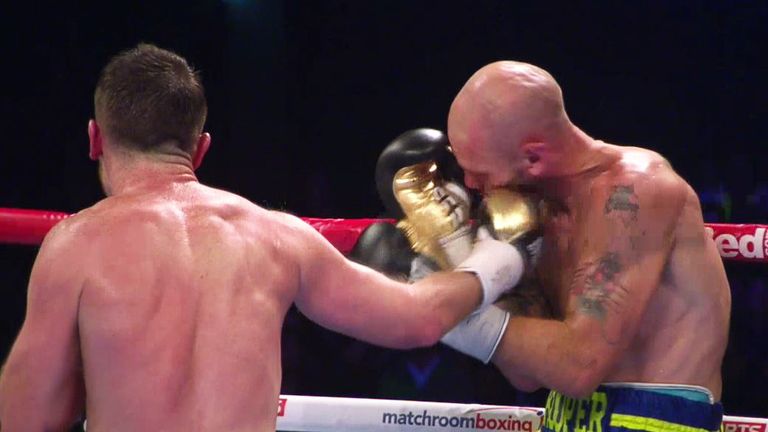 Cardle lands a right hook as Hooper retreats to the ropes