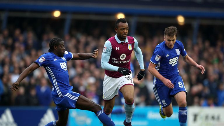 Aston Villa's Jordan Ayew (centre) amd Birmingham City's Clayton Donaldson (left) battle for the ball