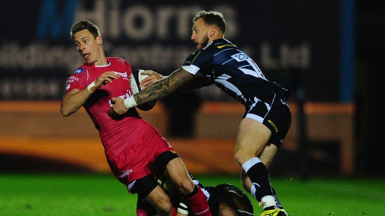 Liam Williams is tackled by Byron McGuigan