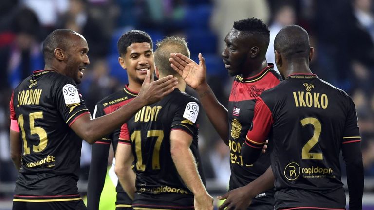 Guimgamp players celebrate after beating Lyon