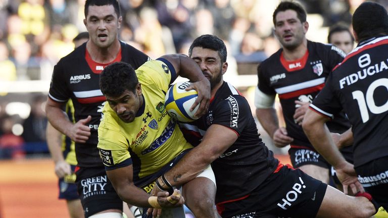 Clermont's centre Wesley Fofana is tackled by Toulouse's centre Yann David