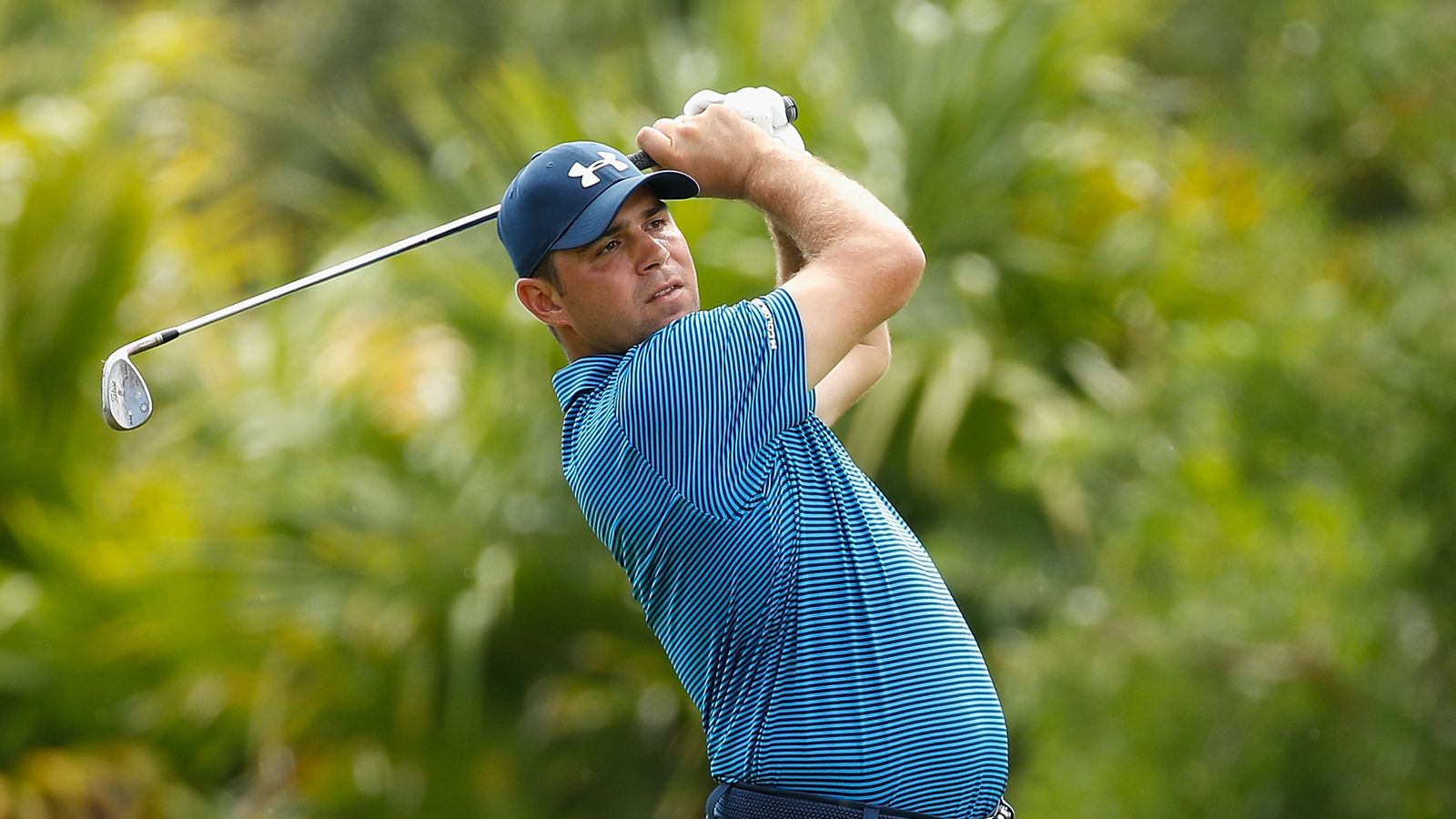 Gary Woodland's ball hits a grandstand railing and ends up in a lake