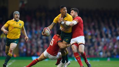 Israel Folau is tackled by Leigh Halfpenny and Alex Cuthbert