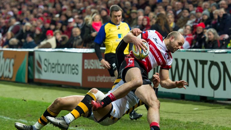 Charlie Sharples is tackled by Josh Bassett of Wasps 