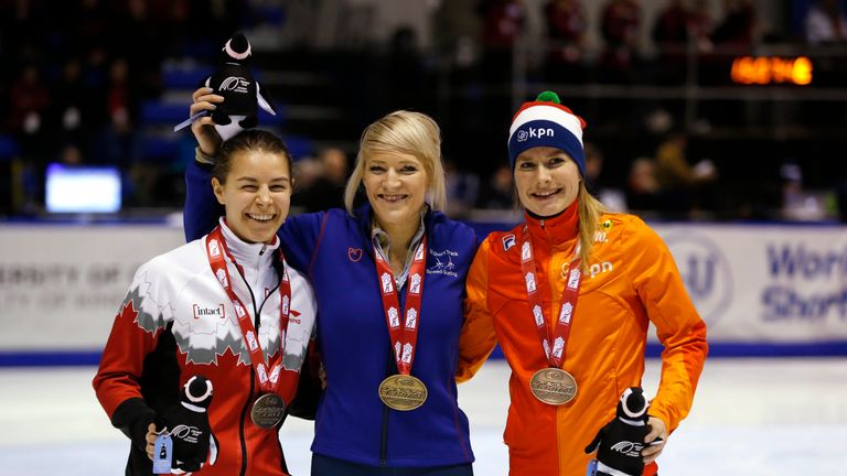 Christie (C) with her reward alongside Jamie MacDonald (L) and Yara van Kerkhof (R) 