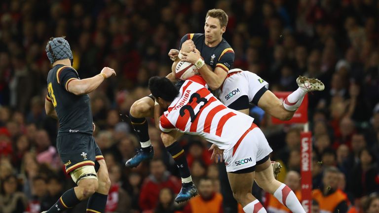 Liam Williams of Wales wins a high ball ahead of Amanaki Lotoahea and Kenki Fukuoka