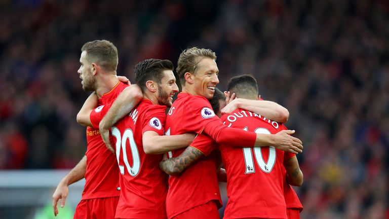 Philippe Coutinho celebrates with his Liverpool team-mates after scoring