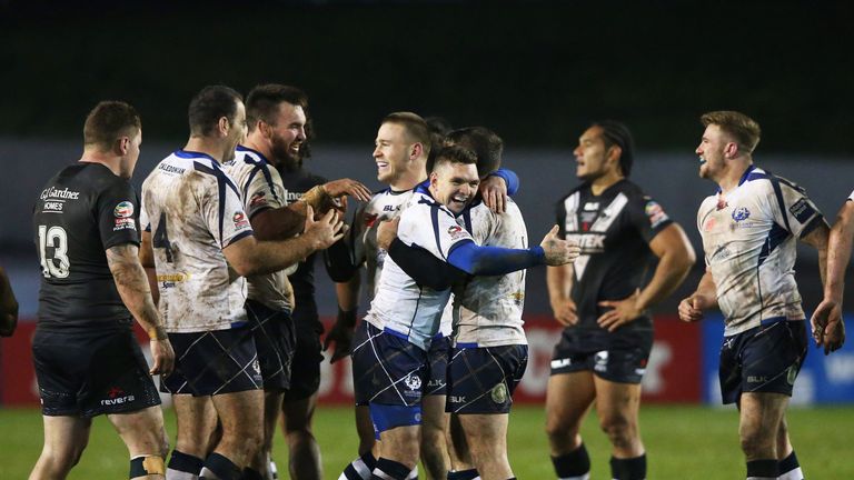 Danny Brough and Lachlan Coote (middle) celebrate after Scotland's dramatic draw