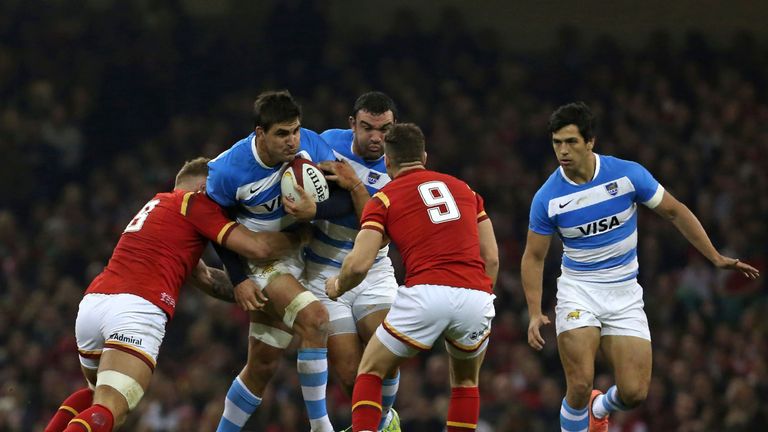 Pablo Matera is tackled by Wales No 8 Ross Moriarty (right)