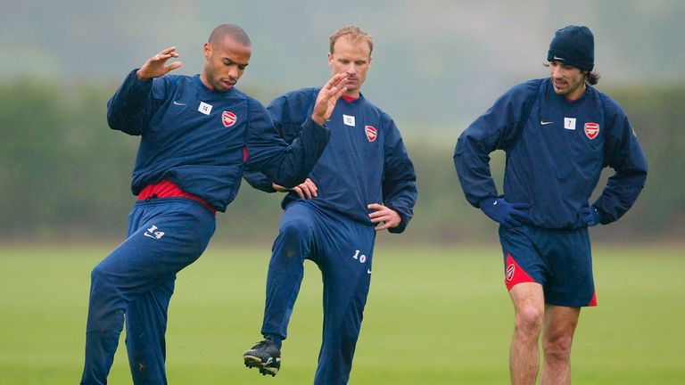 Robert Pires (right) has likened current Arsenal playmaker Ozil Bergkamp (centre)