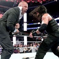 Roman Reigns nails Triple H with a steel chair