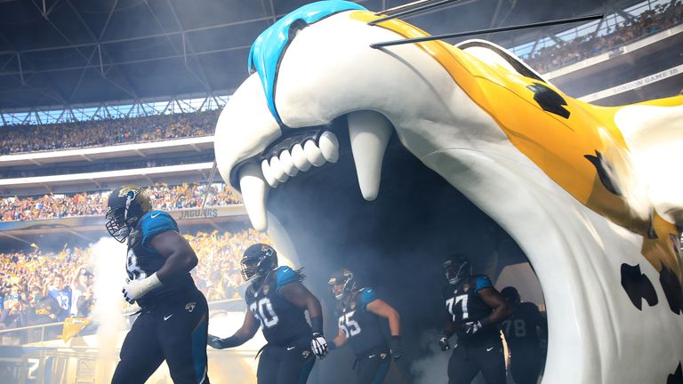 The Jacksonville team run out on to the pitch ahead of the NFL International Series match between Indianapolis Colts and Jacksonville Jaguars in London