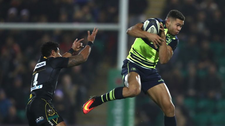 Adam Byrne beats Ken Pisi to a high ball