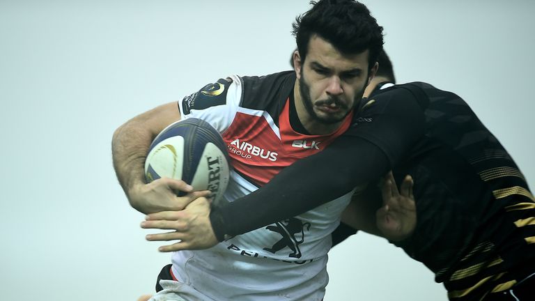 Toulouse's Arthur Bonneval escapes from a tackle