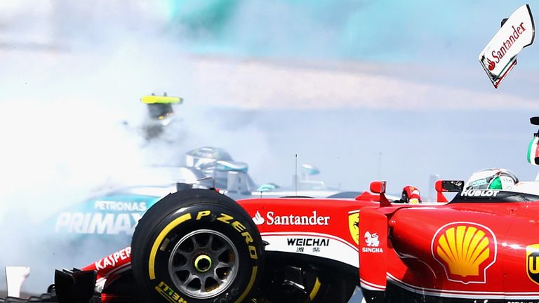 The Ferrari of Sebastian Vettel and Nico Rosberg's Mercedes collide at the start of the Malaysia GP - Picture from Getty Images