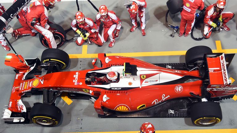 The Ferrari team make a pit-stop during the Singapore GP - Picture from Sutton Images