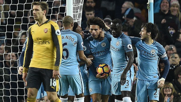 Leroy Sane (C) is congratulated after his first goal for Manchester City drew them level against Arsenal