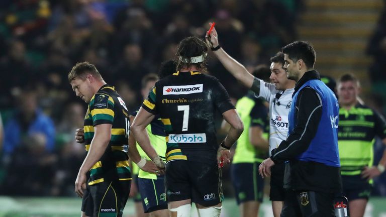 Dylan Hartley walks off the pitch after being shown the red card by referee Jerome Garces for a swinging arm