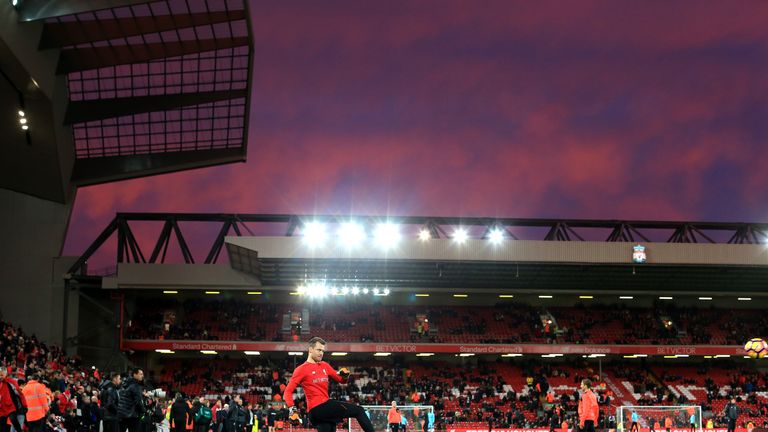 Liverpool players warm up prior to the match