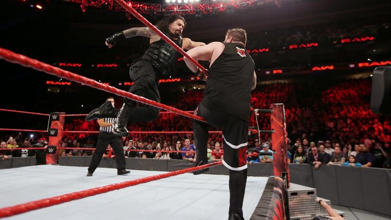 Roman Reigns blasts Kevin Owens with a Superman punch