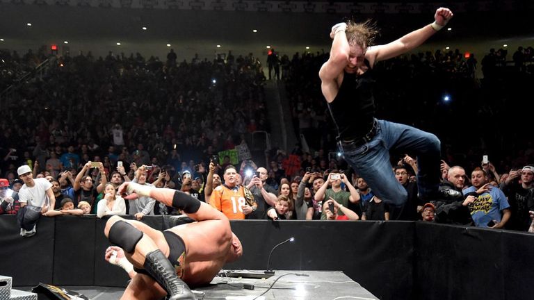 An overzealous Dean Ambrose fell through the announce desk