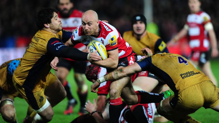 Will Heinz is tackled by Jon Fisher of Bristol