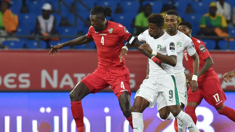 Ivory Coast's forward Wilfried Zaha (right) challenges Togo's forward Emmanuel Adebayor