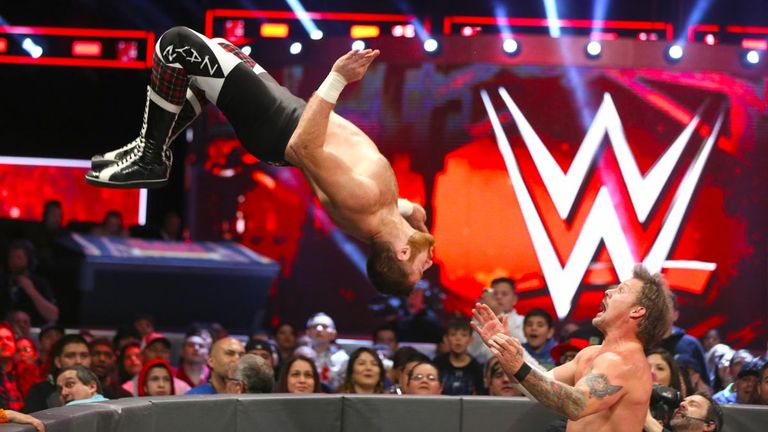 Sami Zayn performs a moonsault on Chris Jericho