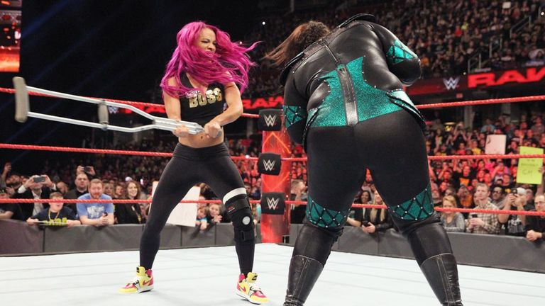 Sasha Banks batter Nia Jax with her crutch