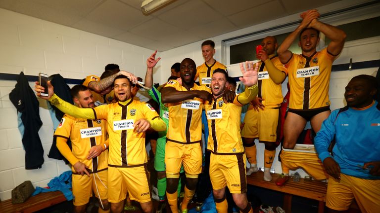 Sutton United players celebrate after the game
