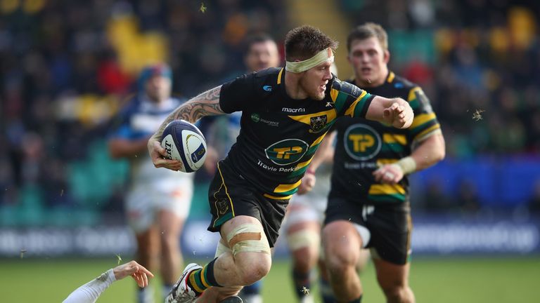 Teimana Harrison of Northampton is tackled by Julien Dumora of Castres 