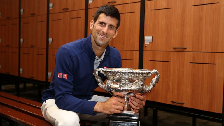 Djokovic poses with the Norman Brookes Challenge Cup