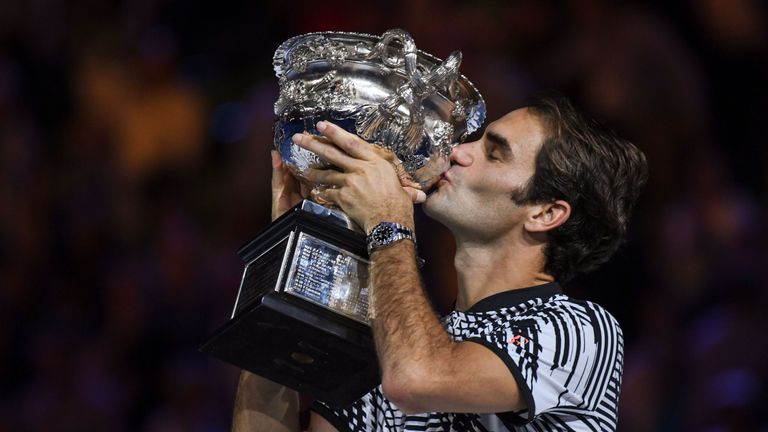 Roger Federer kisses the Norman Brookes Challenge Cup