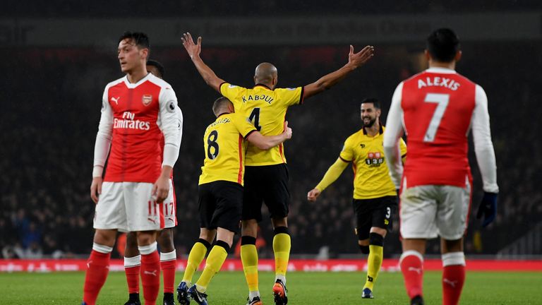 Younes Kaboul (C) of Watford celebrates scoring the opening goal
