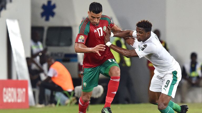 Ivory Coast forward Wilfried Zaha (R) challenges Morocco midfielder Nabil Dirar