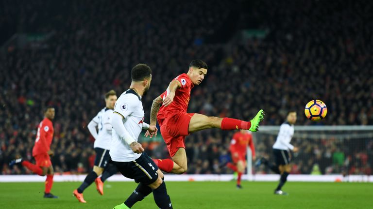 Philippe Coutinho (right) flicks the ball on against Tottenham