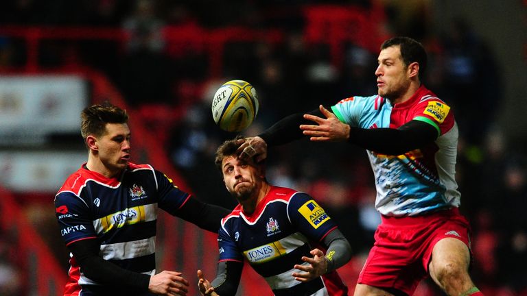 Jack Wallace contests a high ball with Harlequins wing Tim Visser