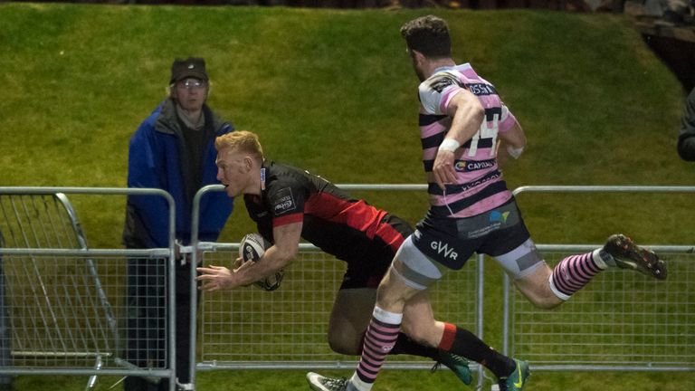 Rory Scholes scores his first of two tries