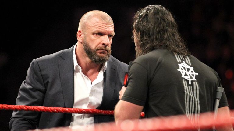 Triple H stares down rival Seth Rollins on Raw